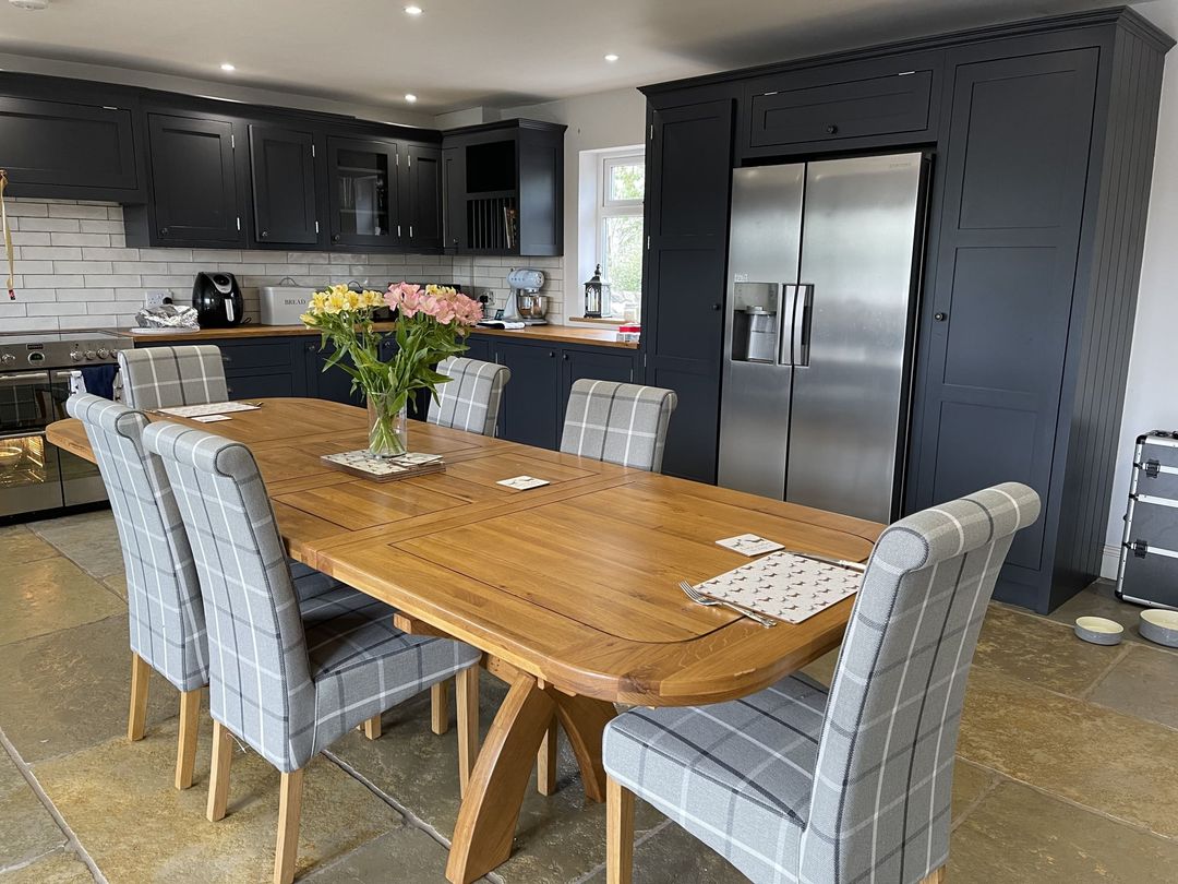 Dining table with fabric chairs in kitchen