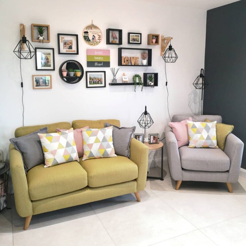 Yellow sofa and grey armchair with colourful cushions