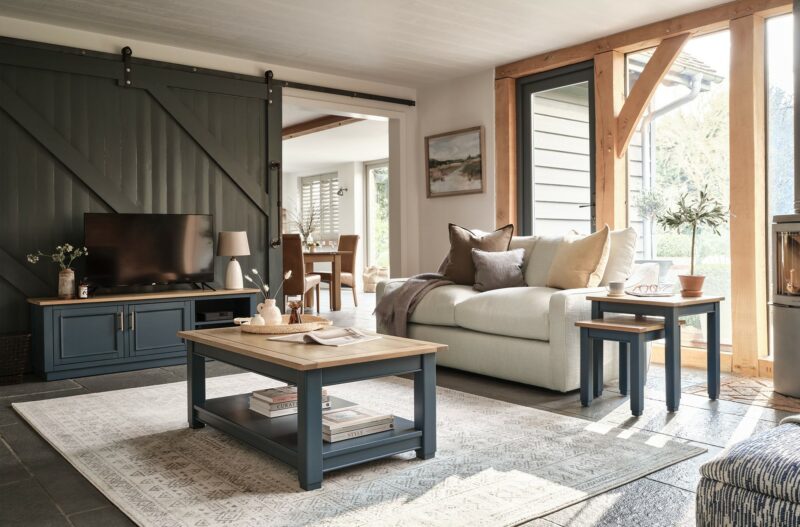 A coffee table, TV unite, nest of tables and sofa-living room furniture-wooden coffee table painted dark blue with shelf-dark blue TV unit-dark blue nest of tables-cream 3-seater sofa