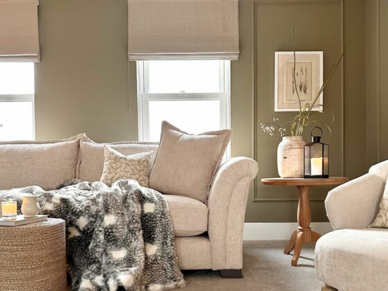 Oak Furntureland Ashby sofa in neutral living room with pale green walls, cosy accessories and neutral details.