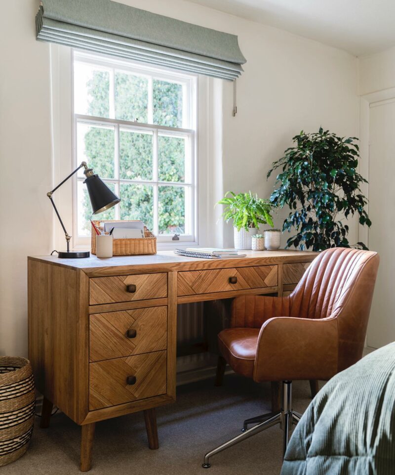 Oak Furnitureland Parquet desk in a peaceful home office with houseplants.