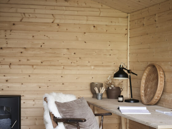 Panelled home office with a wood-burning stove and tactile accessories.