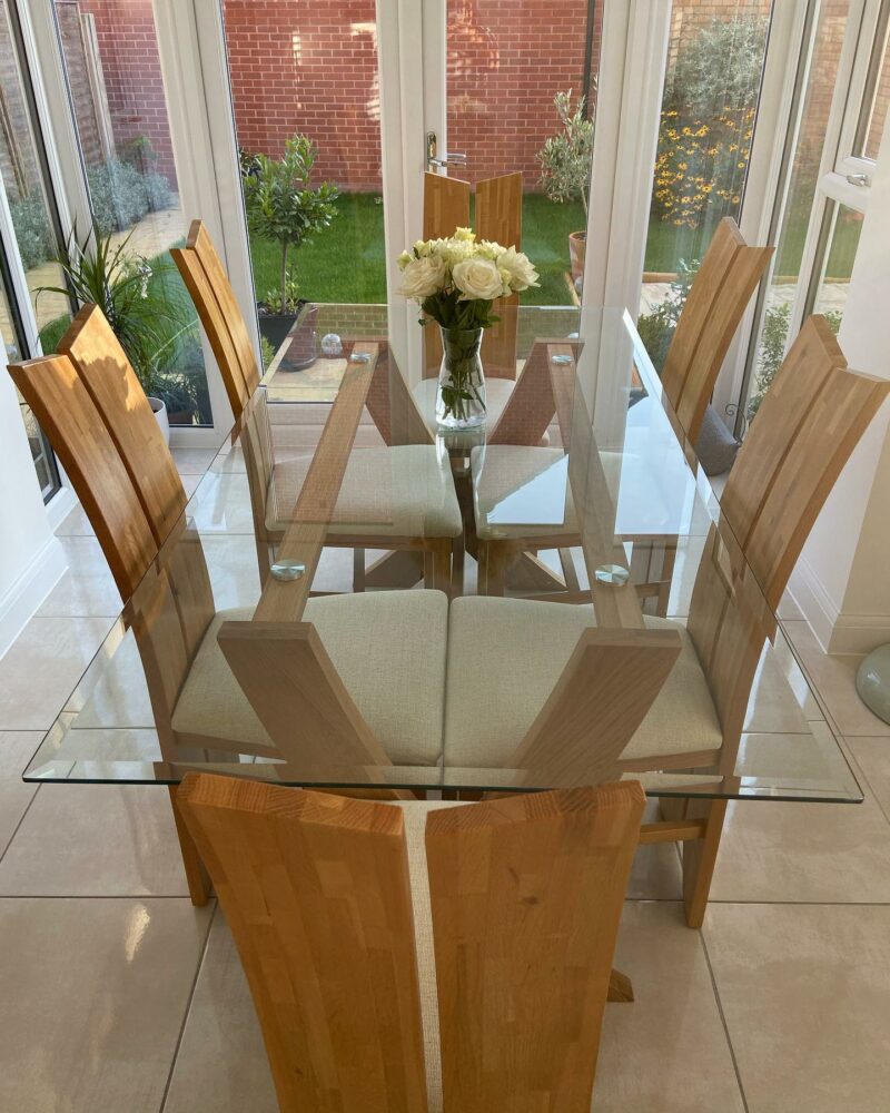 Glass dining table in a conservatory