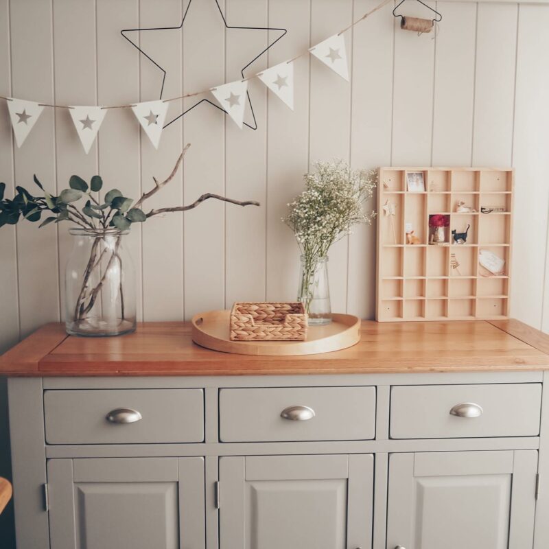 Oak Furnitureland St. Ives painted grey sideboard, decorated with greenery & natural accessories.
